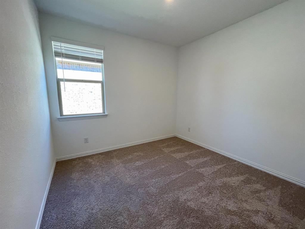 3305 Tulip Poplar Trail McKinney, TX 75071 - Photo 11 of 29 an empty room with a window