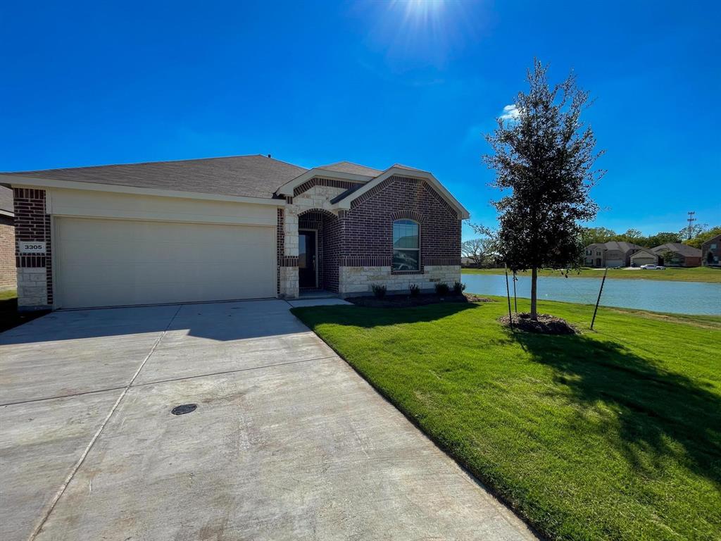 3305 Tulip Poplar Trail McKinney, TX 75071 - Photo 2 of 29 a front view of a house with a garden and yard