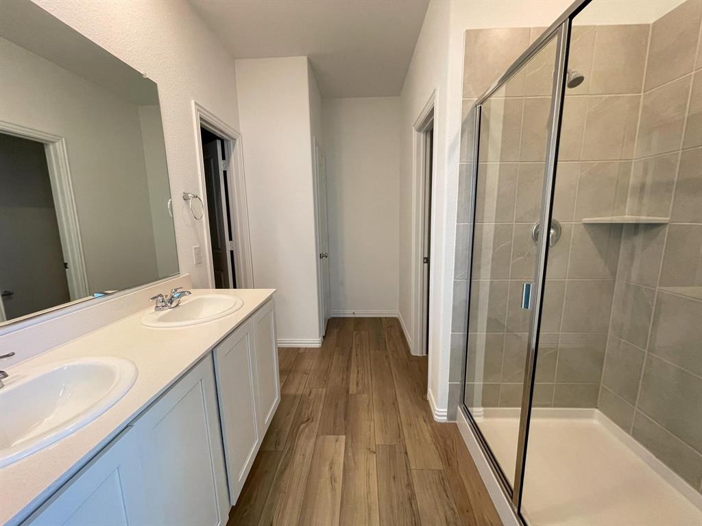 3305 Tulip Poplar Trail McKinney, TX 75071 - Photo 22 of 29 a bathroom with a sink and a mirror