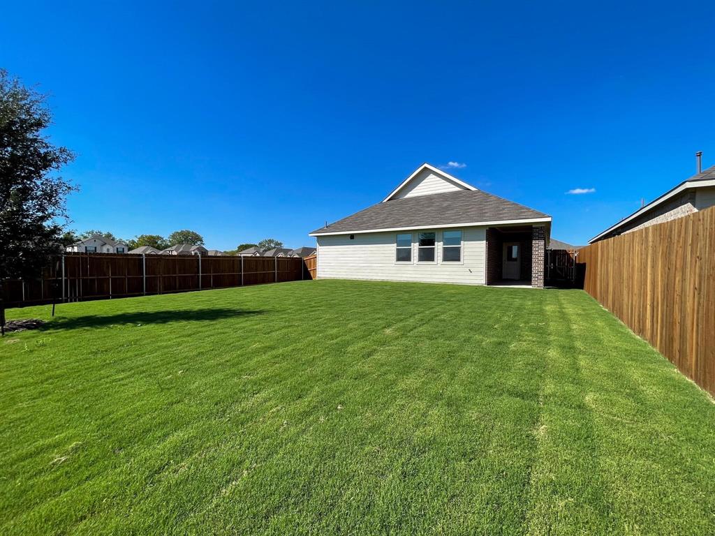 3305 Tulip Poplar Trail McKinney, TX 75071 - Photo 27 of 29 a front view of a house with garden