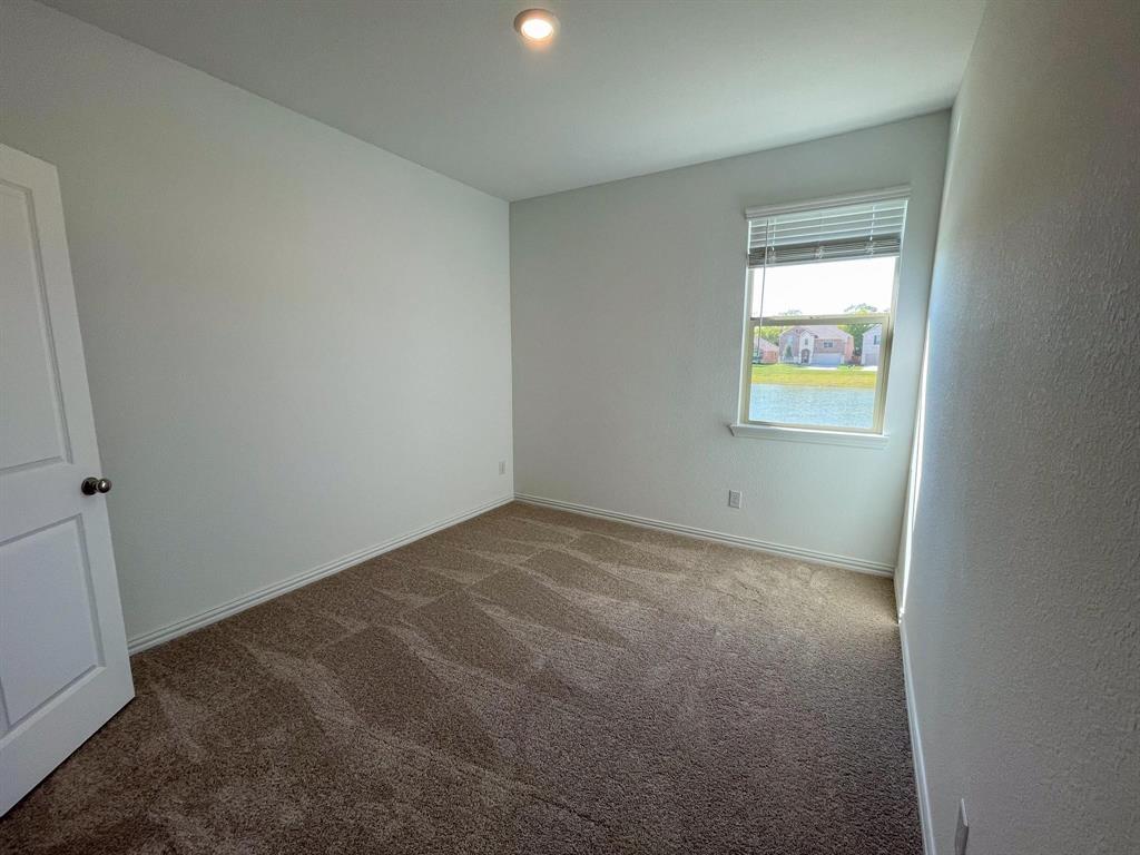 3305 Tulip Poplar Trail McKinney, TX 75071 - Photo 6 of 29 an empty room with a window
