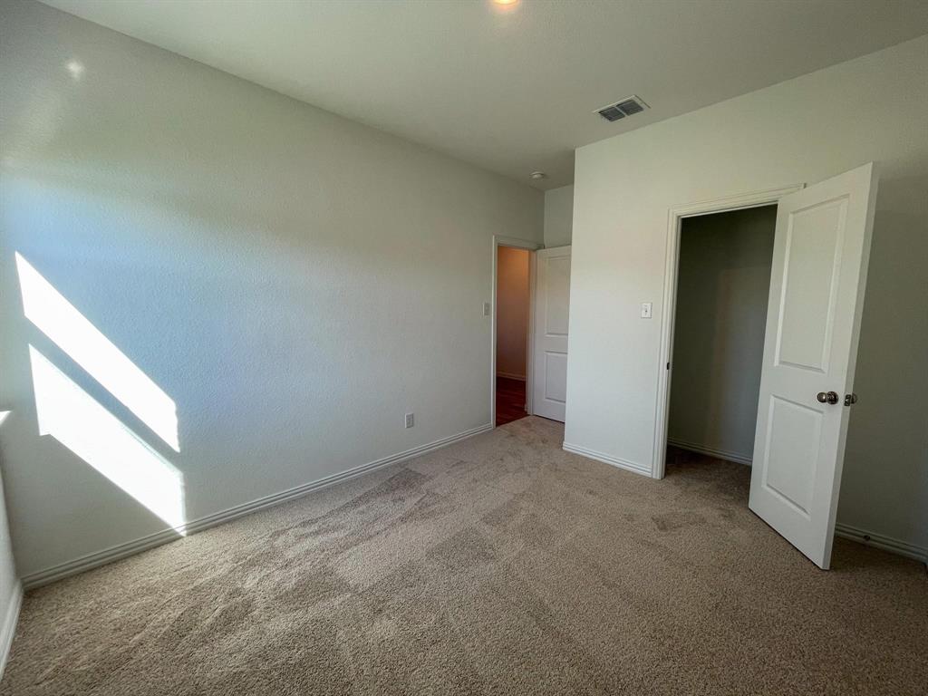 3305 Tulip Poplar Trail McKinney, TX 75071 - Photo 7 of 29 a view of an empty room and window