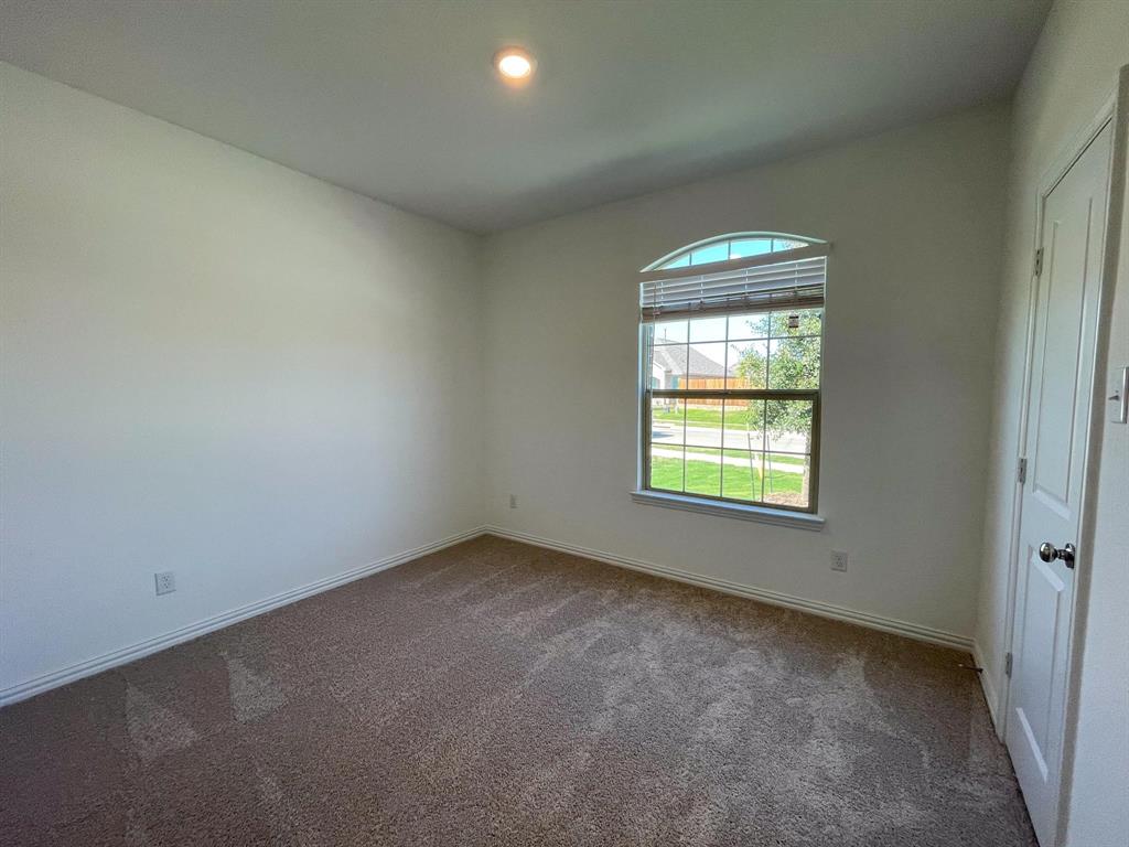 3305 Tulip Poplar Trail McKinney, TX 75071 - Photo 9 of 29 an empty room with a window