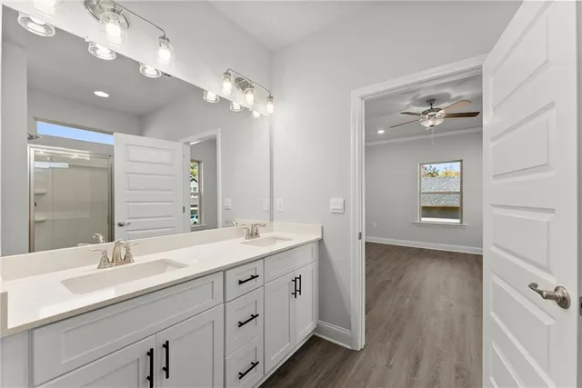 a bathroom with a double vanity sink and a mirror