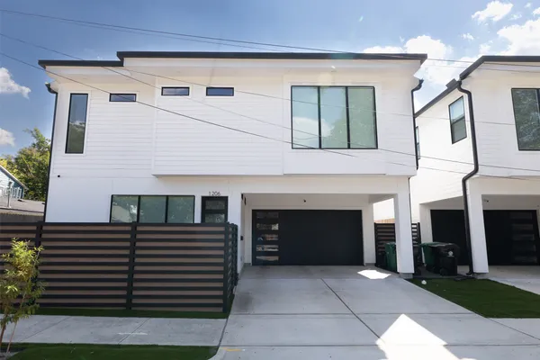 a front view of a house with garage