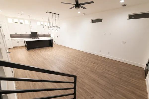 a kitchen with kitchen island sink and faucet