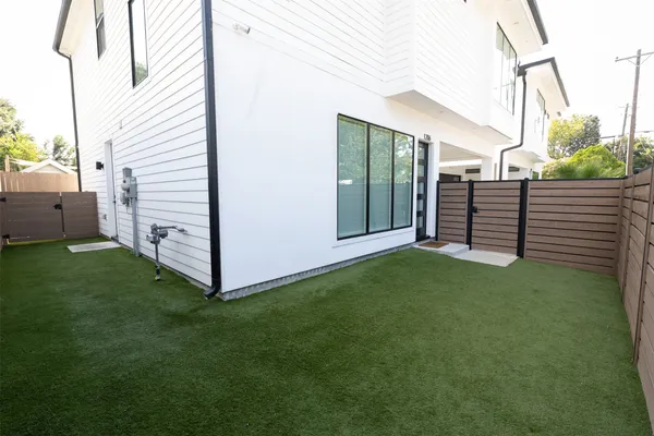 a backyard of a house with lots of green space