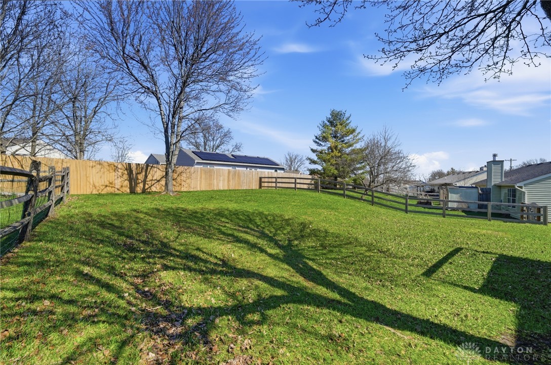 280 Stillpass Way Monroe, OH 45050 - Photo 43 of 49 This spacious yard offers ample outdoor living possibilities and includes a secure wooden fence.