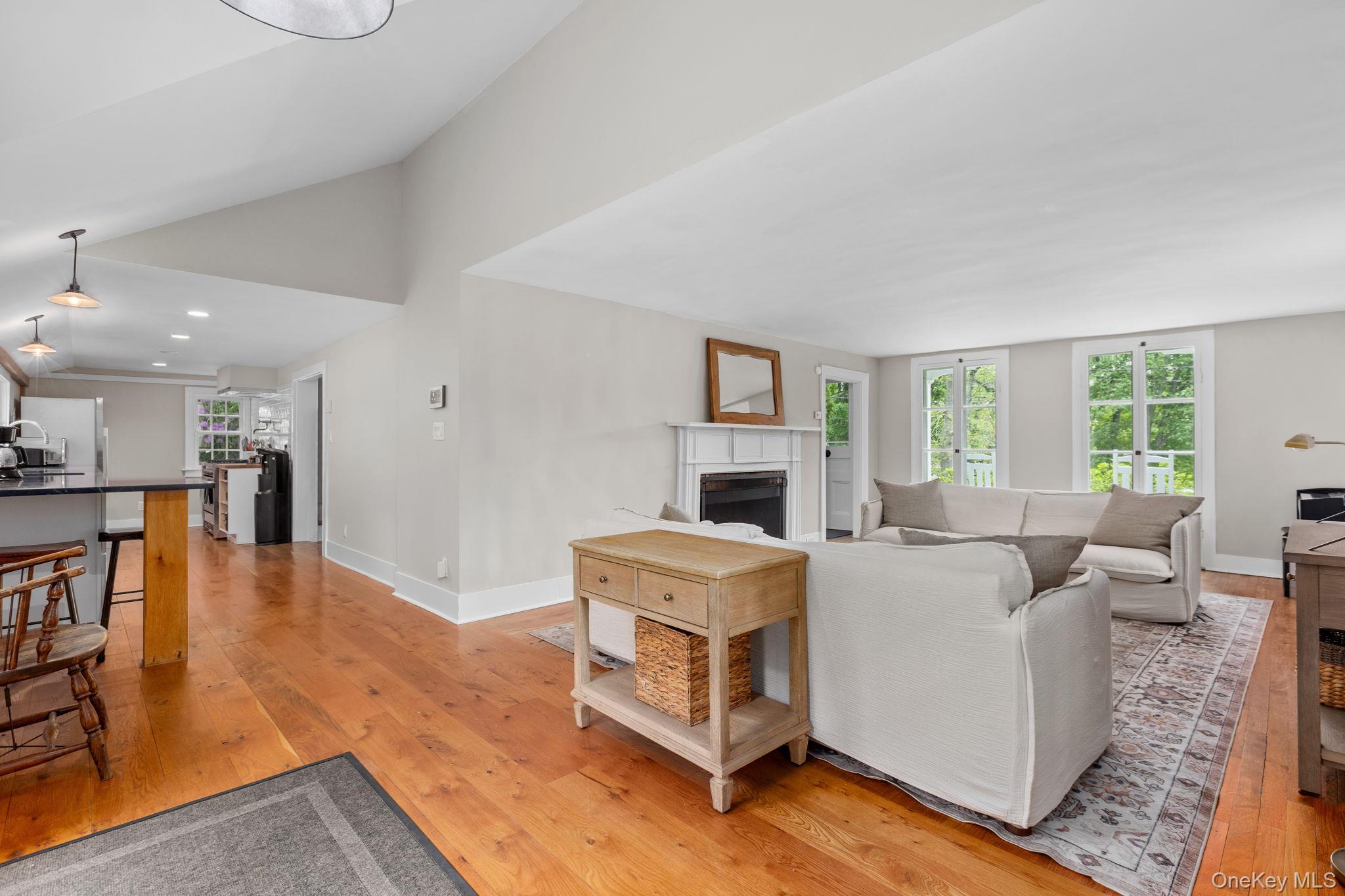 23 Pound Ridge Road Pound Ridge, NY 10576 - Photo 7 of 40 a living room with furniture and a table