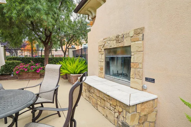 an outdoor sitting area with furniture
