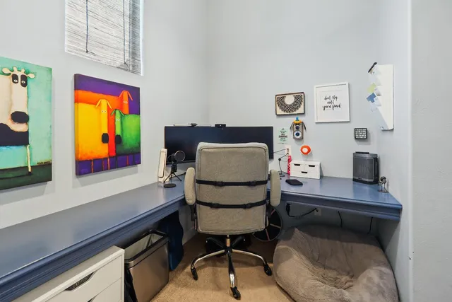 a workspace with furniture and window