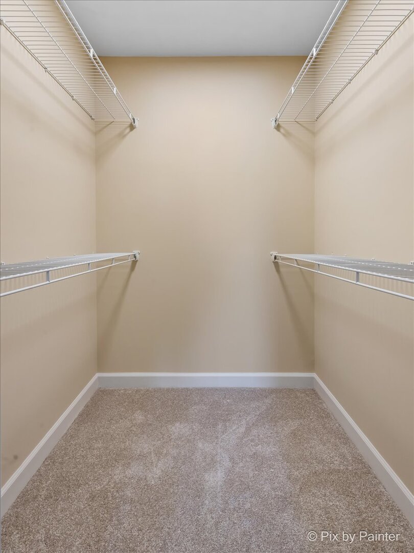 11727 Davey Drive, Unit B Huntley, IL 60142 - Photo 18 of 25 a view of a room with racks on the wall