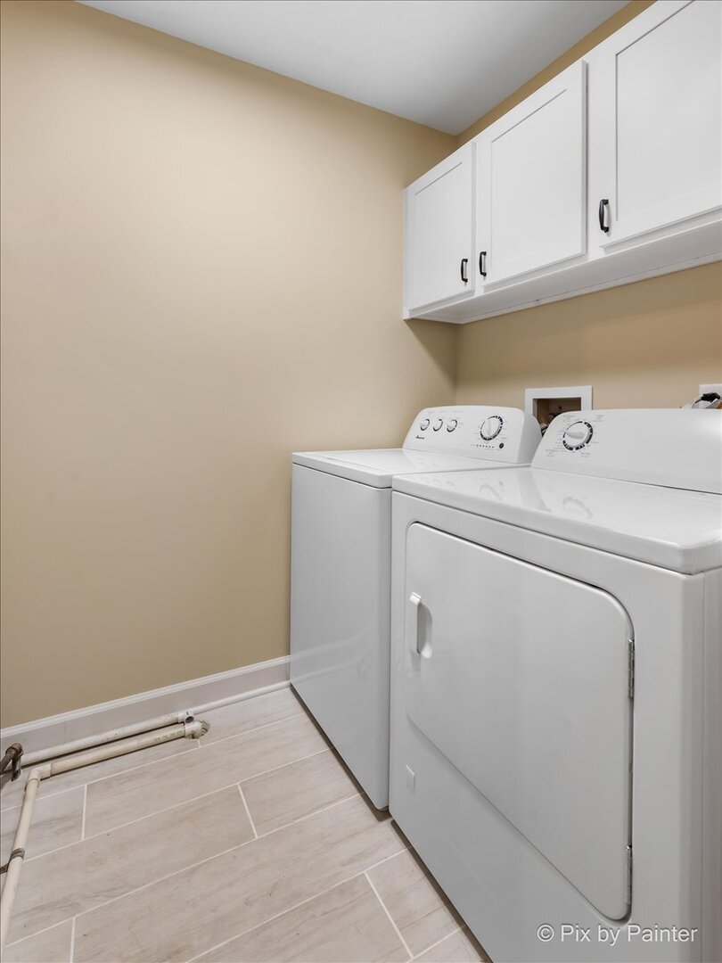 11727 Davey Drive, Unit B Huntley, IL 60142 - Photo 19 of 25 a view of storage and utility room with washer and dryer