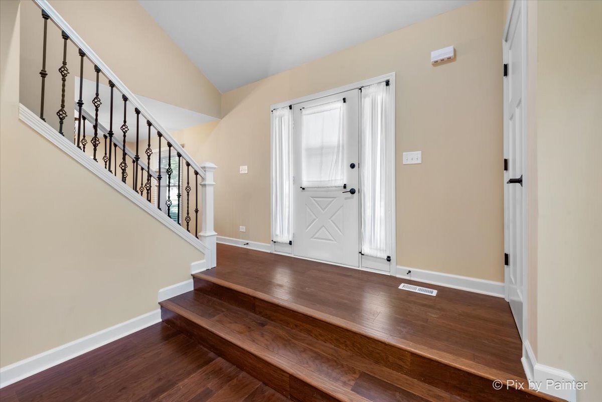 11727 Davey Drive, Unit B Huntley, IL 60142 - Photo 2 of 25 a view of an entryway with wooden floor