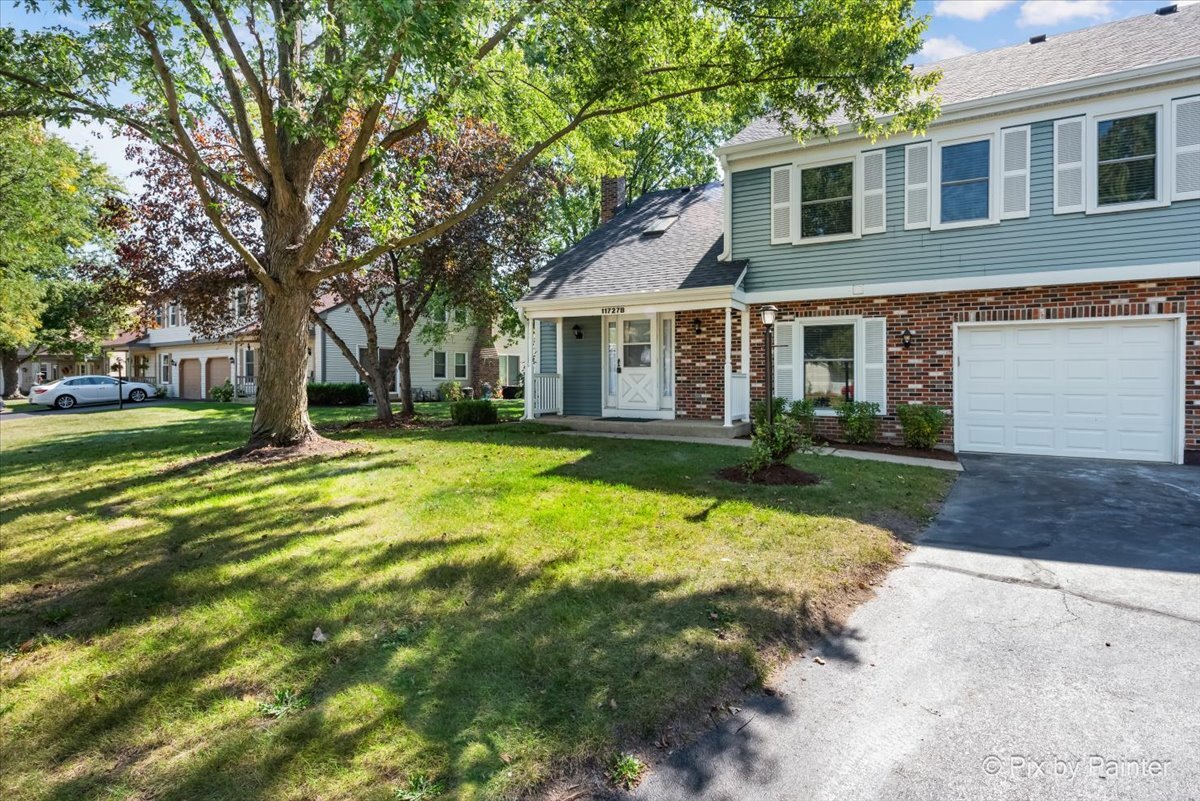 11727 Davey Drive, Unit B Huntley, IL 60142 - Photo 21 of 25 a view of a house with a yard