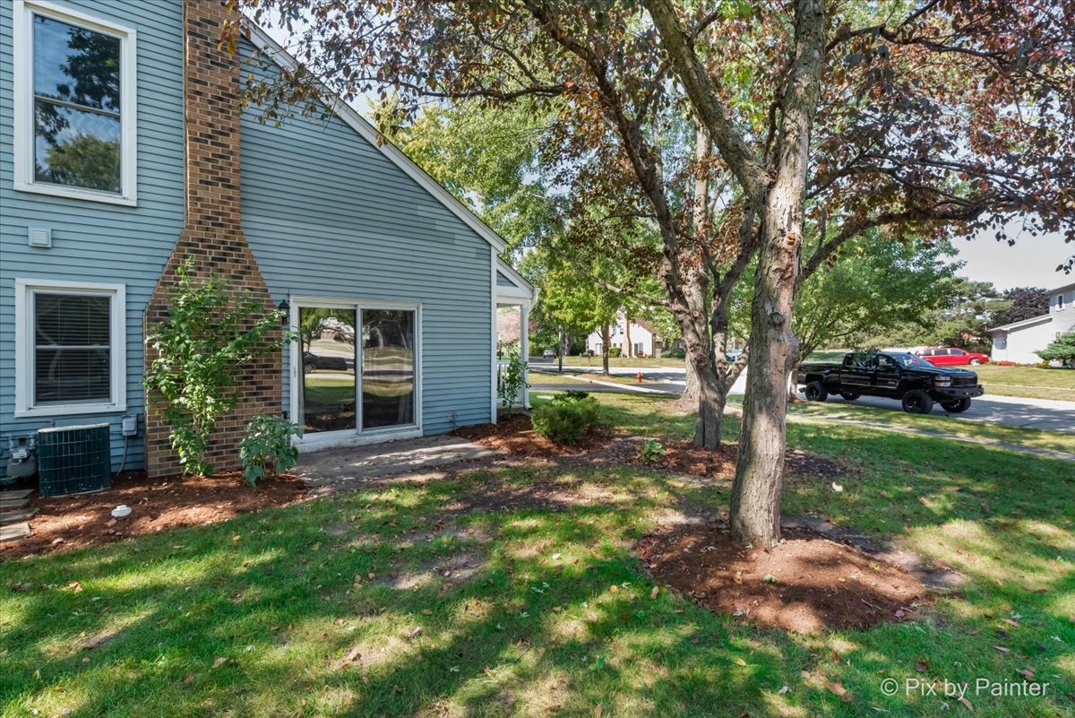 11727 Davey Drive, Unit B Huntley, IL 60142 - Photo 25 of 25 a view of a house with a yard