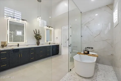 an empty room with a bathroom and a shower