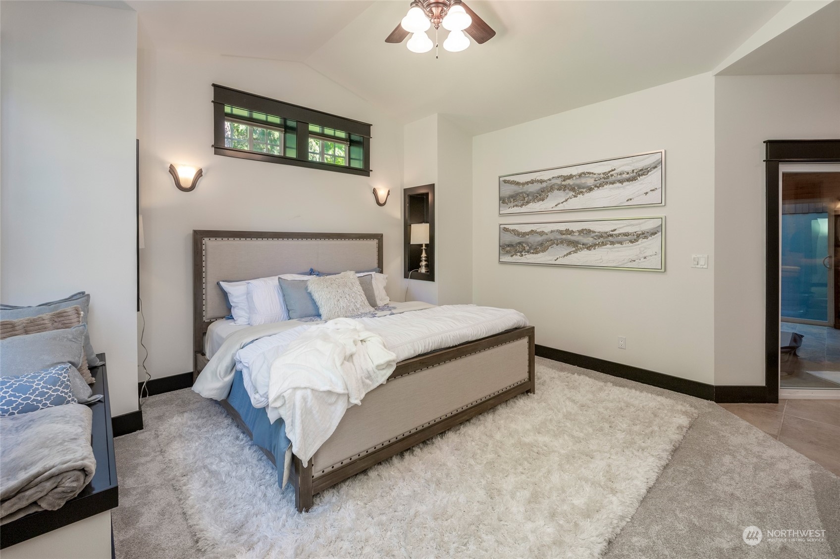 25635 Southeast Old Black Nugget Road Issaquah, WA 98029 - Photo 19 of 39 a bedroom with a bed and a painting on the wall