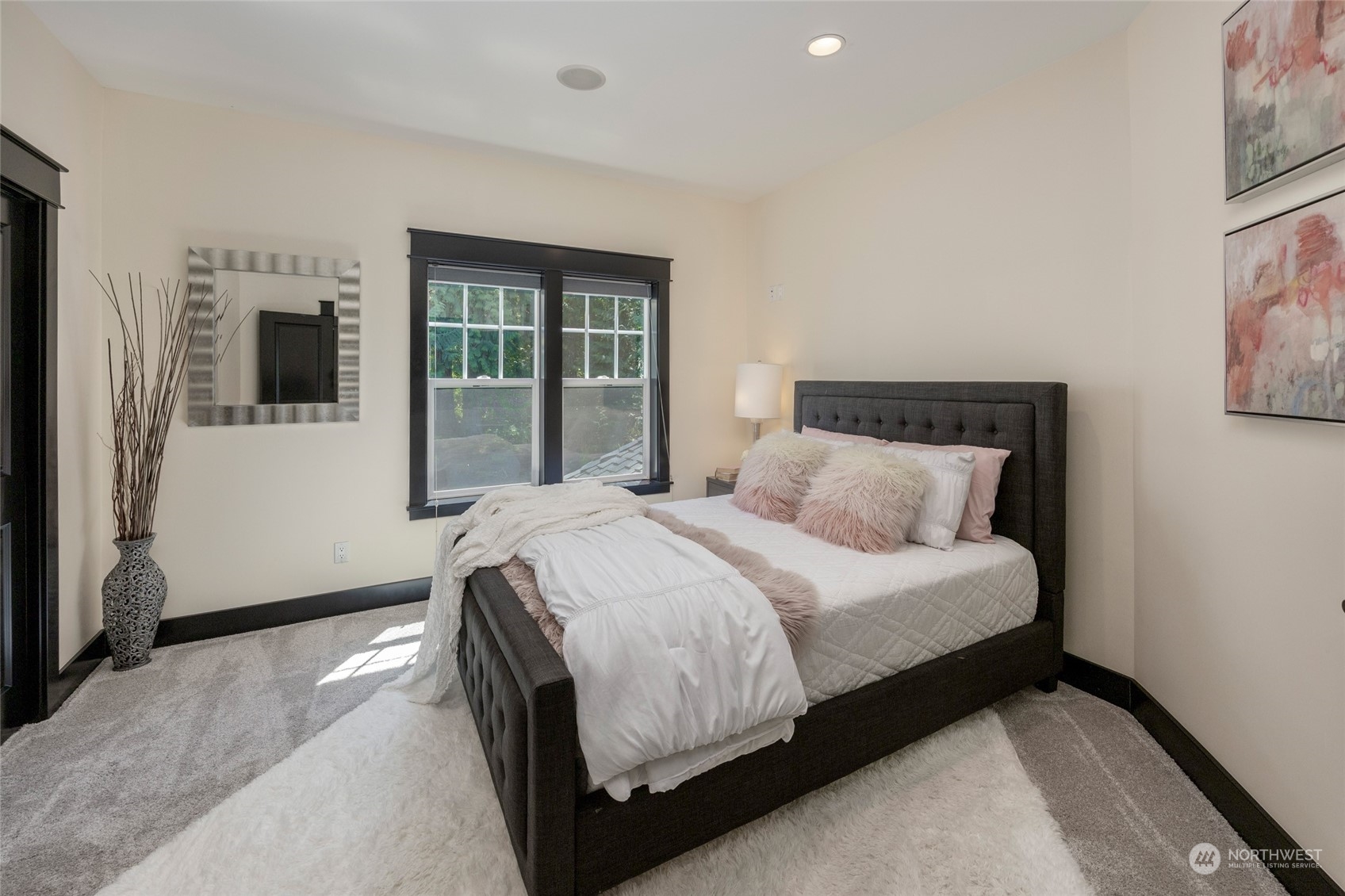 25635 Southeast Old Black Nugget Road Issaquah, WA 98029 - Photo 22 of 39 a bedroom with a large bed and a large window