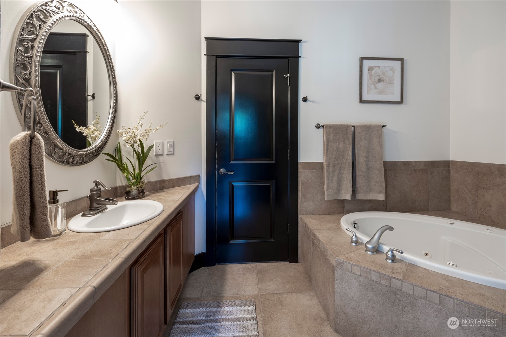 25635 Southeast Old Black Nugget Road Issaquah, WA 98029 - Photo 24 of 39 a bathroom with a bathtub sink and mirror