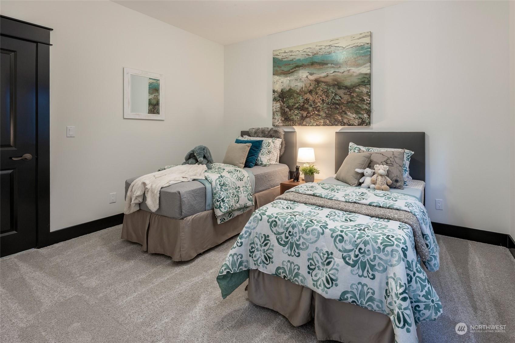 25635 Southeast Old Black Nugget Road Issaquah, WA 98029 - Photo 25 of 39 a bedroom with two beds and painting on the wall