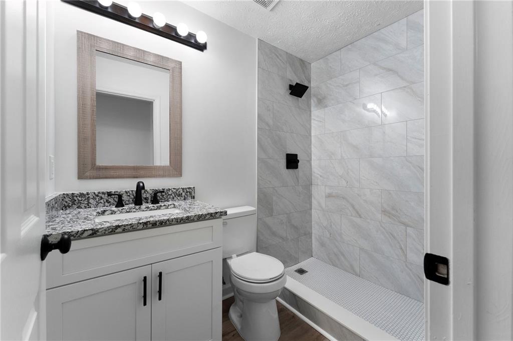20 Mallet Pointe Street Northeast Cartersville, GA 30121 - Photo 28 of 37 a bathroom with a sink toilet and shower
