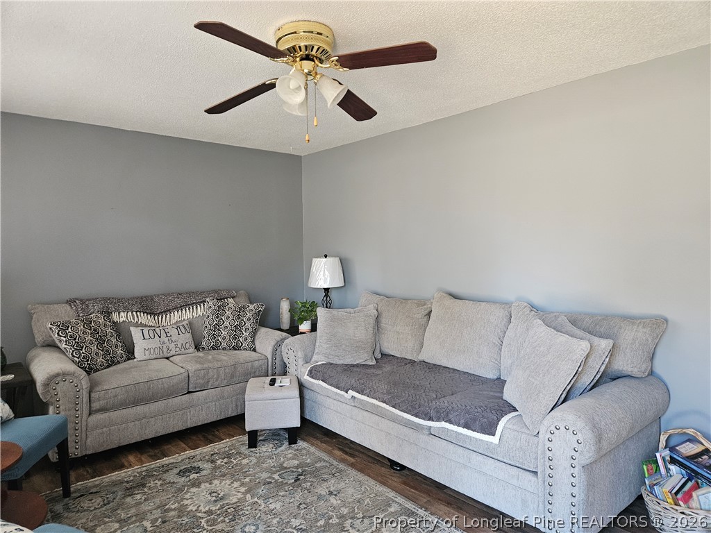 4547 Legion Road Hope Mills, NC 28348 - Photo 5 of 28 a living room with furniture and a couch