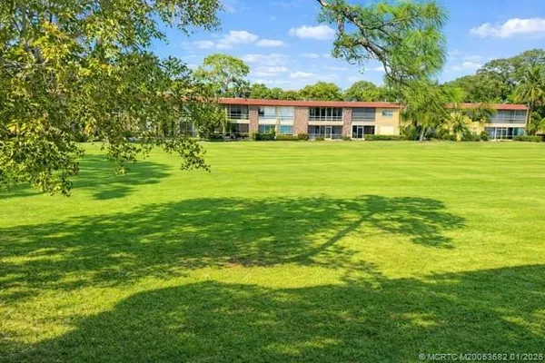 a view of a house with a big yard