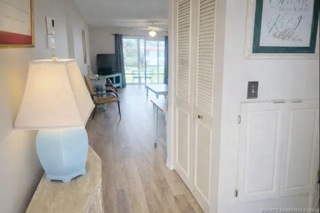 a view of living room with furniture and wooden floor