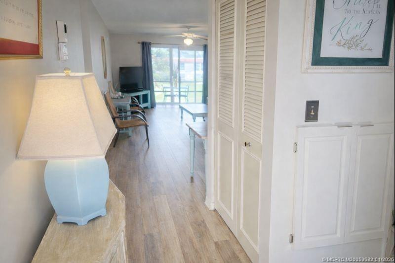 1943 Southwest Palm City Road, Unit 22F Stuart, FL 34994 - Photo 2 of 21 a view of living room with furniture and wooden floor