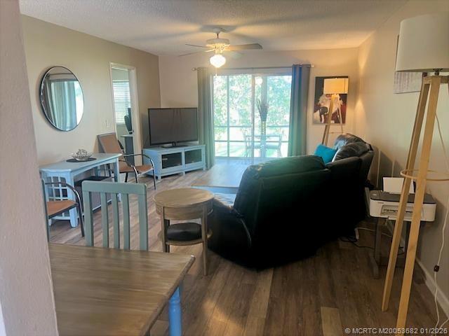 1943 Southwest Palm City Road, Unit 22F Stuart, FL 34994 - Photo 6 of 21 a living room with furniture and a flat screen tv