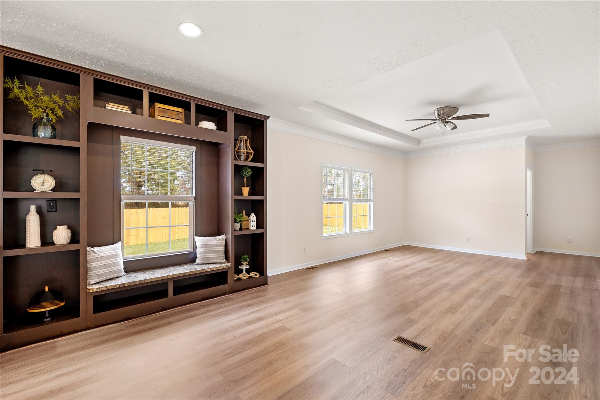 2476 Cimarron Circle Midland, NC 28107 - Photo 12 of 34 wooden floor in an empty room with a window