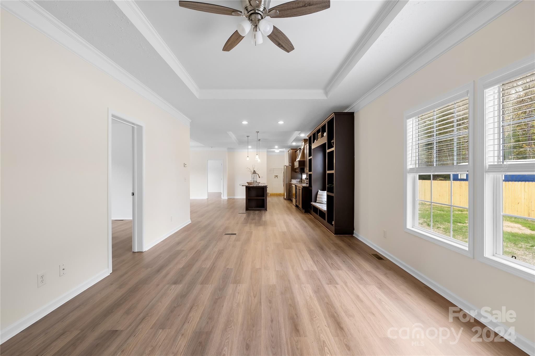 2476 Cimarron Circle Midland, NC 28107 - Photo 14 of 34 a view of empty room with wooden floor and fan