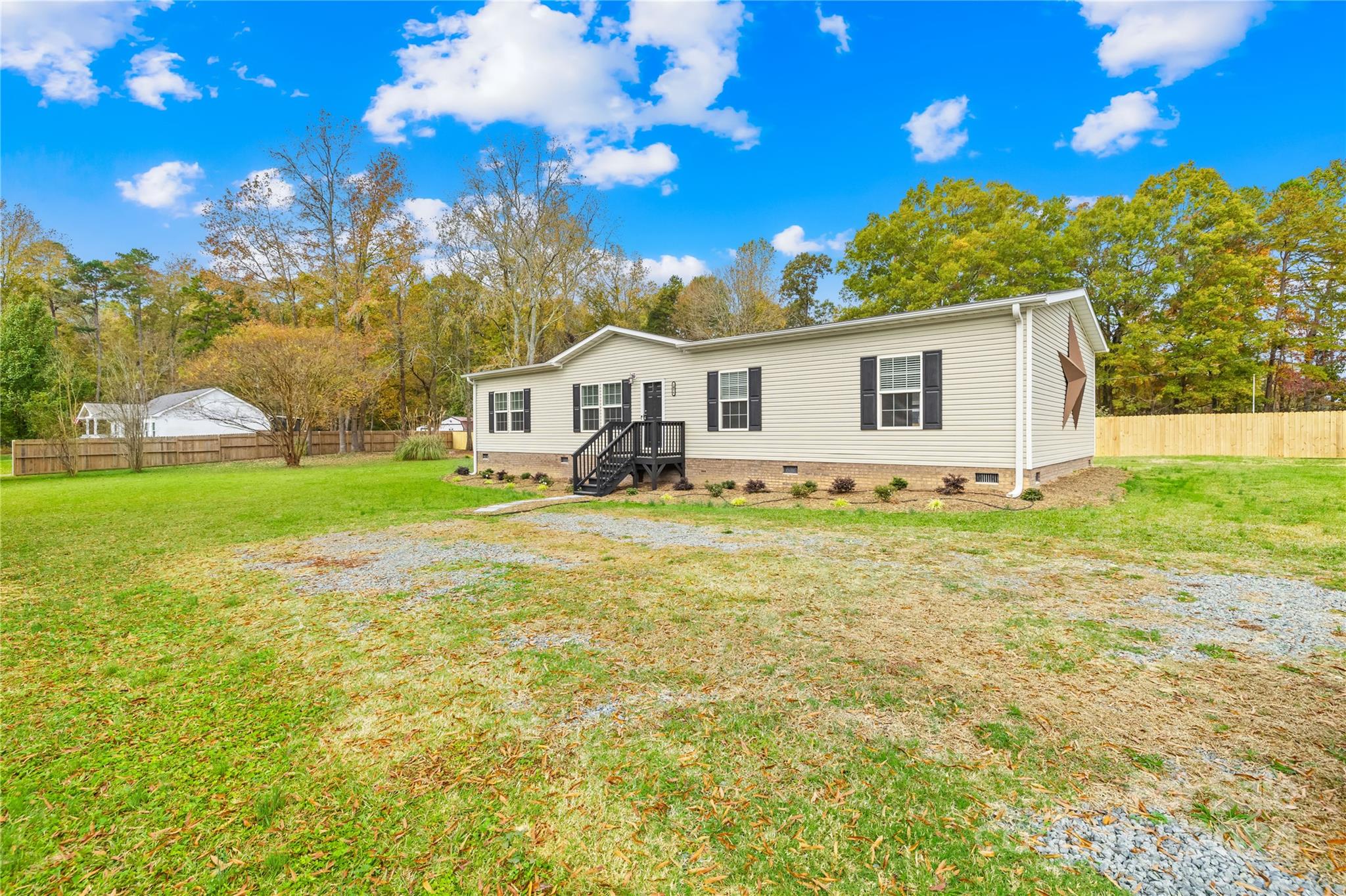2476 Cimarron Circle Midland, NC 28107 - Photo 2 of 34 a front view of house with yard and trees around