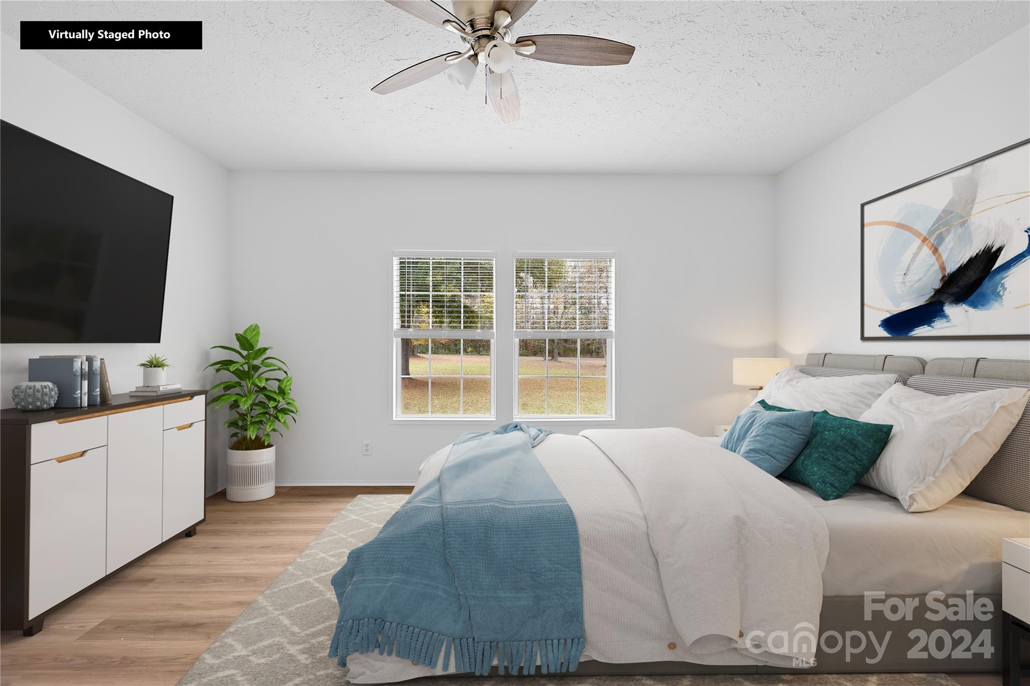 2476 Cimarron Circle Midland, NC 28107 - Photo 21 of 34 a bedroom with a balcony a bed and a flat screen tv