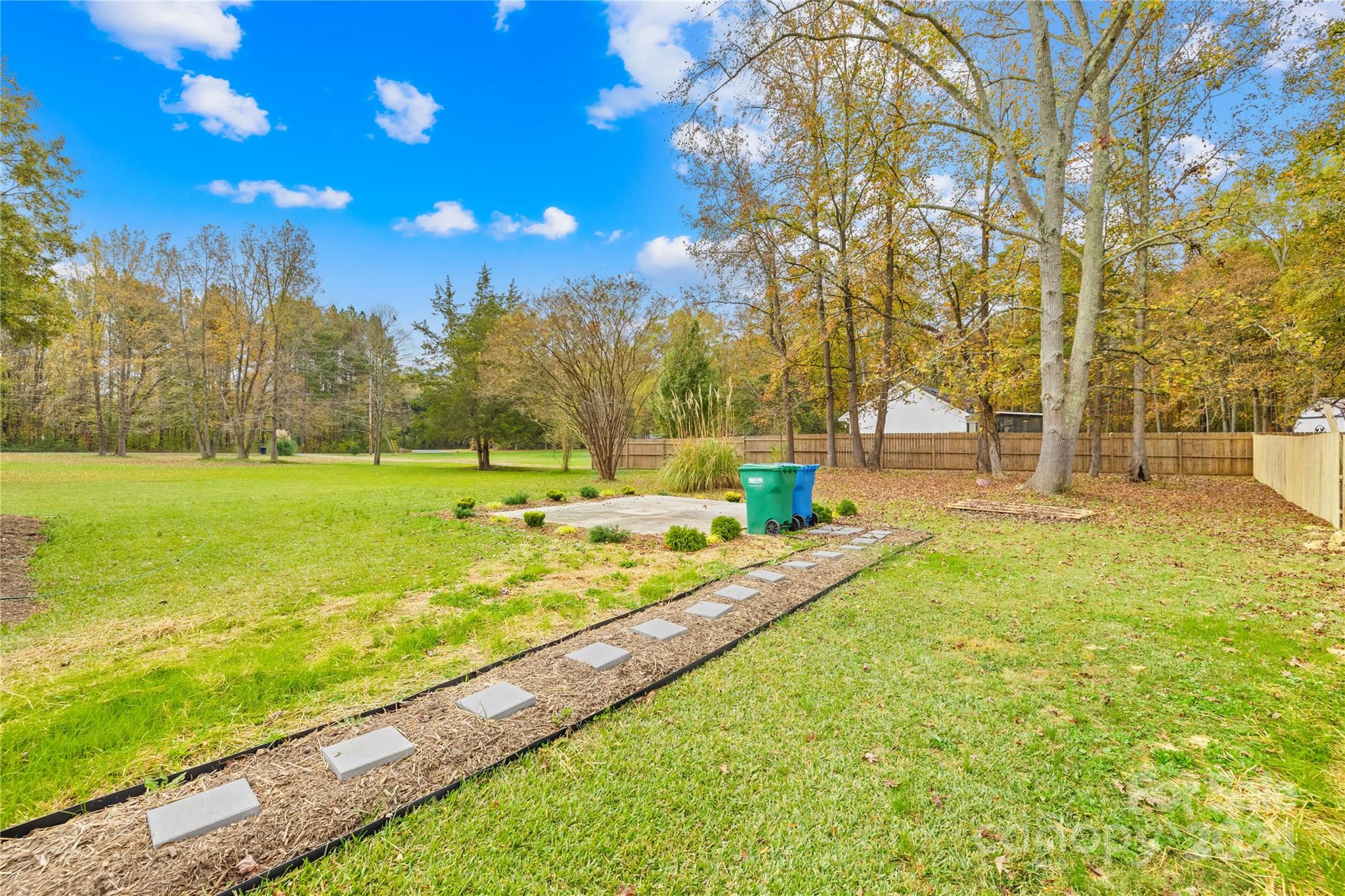 2476 Cimarron Circle Midland, NC 28107 - Photo 30 of 34 a view of yard with swimming pool and trees