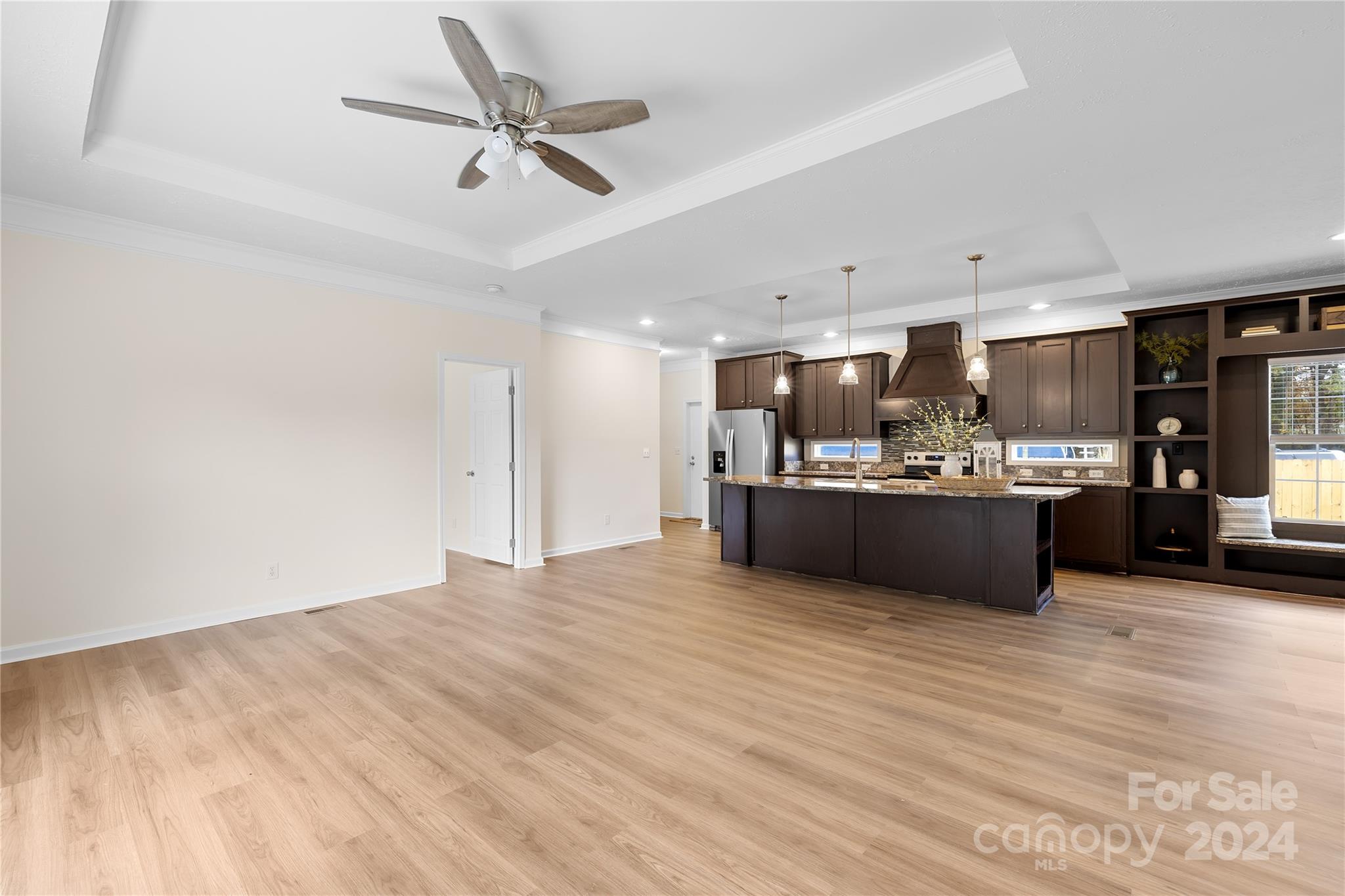 2476 Cimarron Circle Midland, NC 28107 - Photo 4 of 34 a view of kitchen and kitchen island with wooden floor