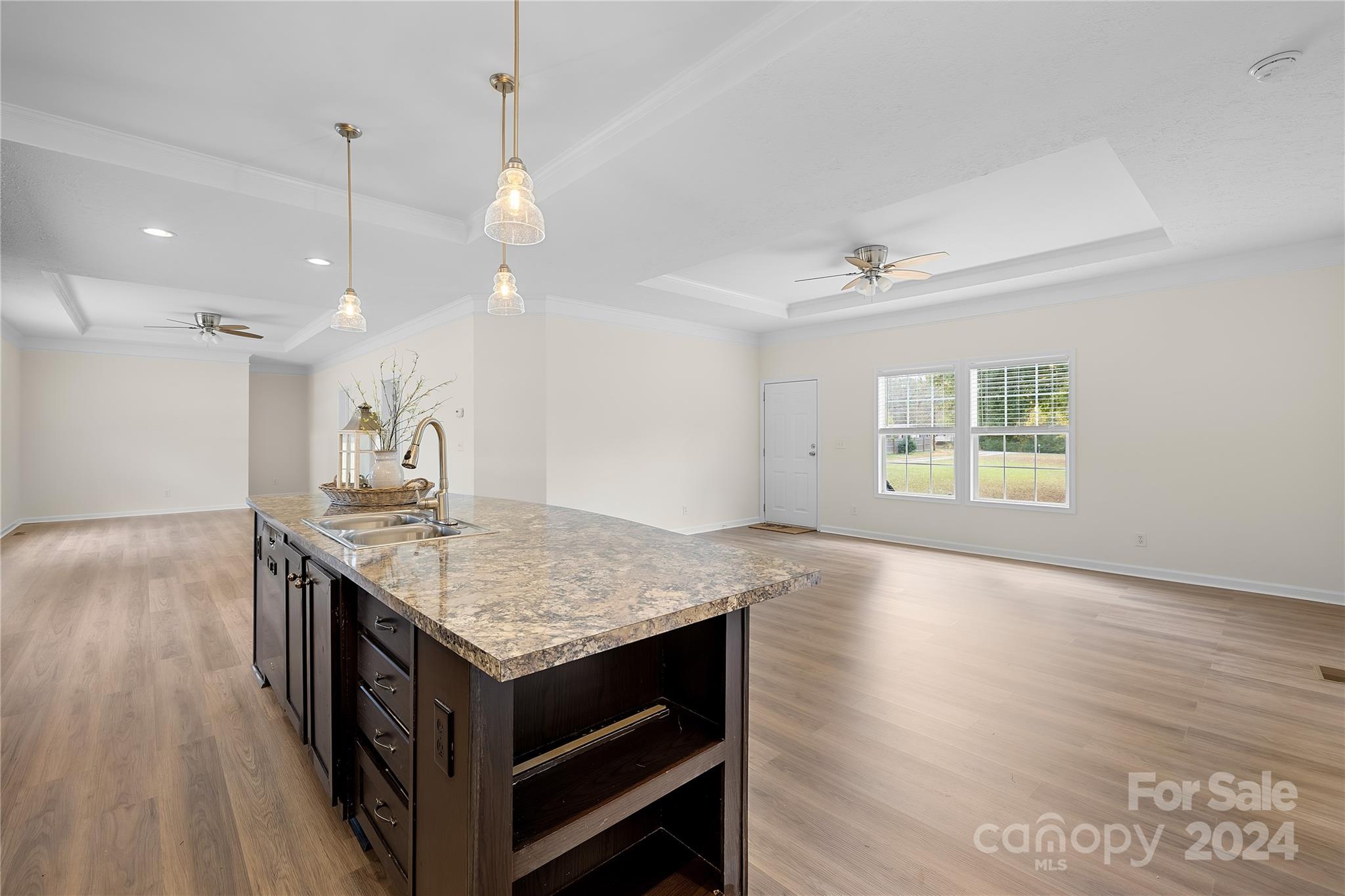2476 Cimarron Circle Midland, NC 28107 - Photo 8 of 34 a kitchen with a stove kitchen island and a wooden floor