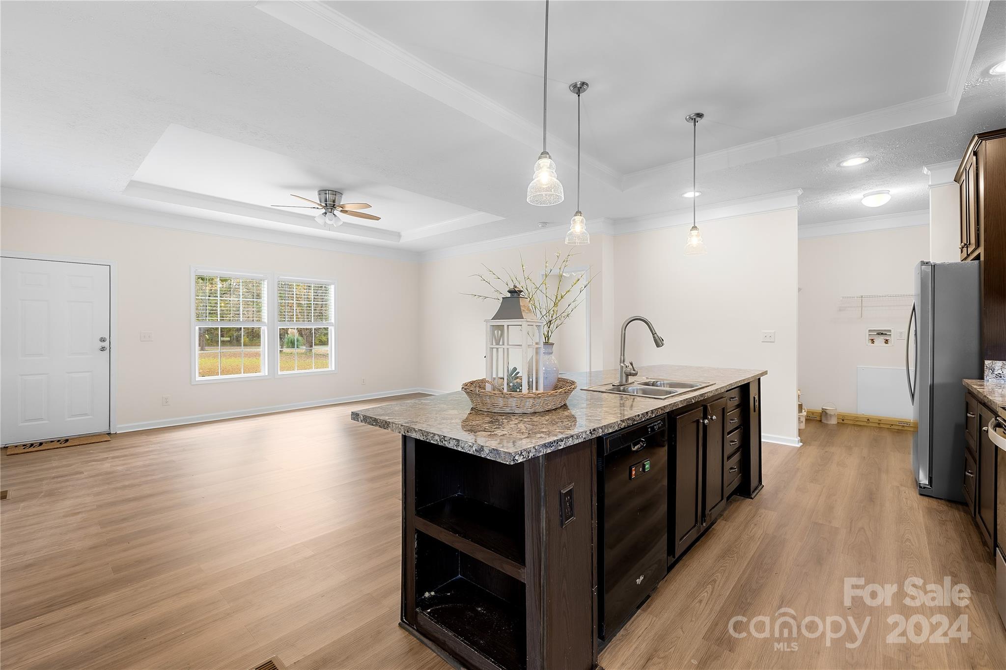 2476 Cimarron Circle Midland, NC 28107 - Photo 10 of 34 a kitchen with stainless steel appliances granite countertop a sink a counter space and a window