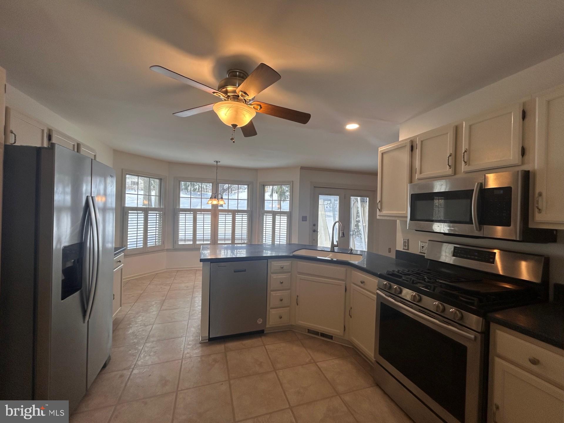 1110 Gora Road South York, PA 17404 - Photo 3 of 15 a kitchen with stainless steel appliances granite countertop a sink and stove top oven