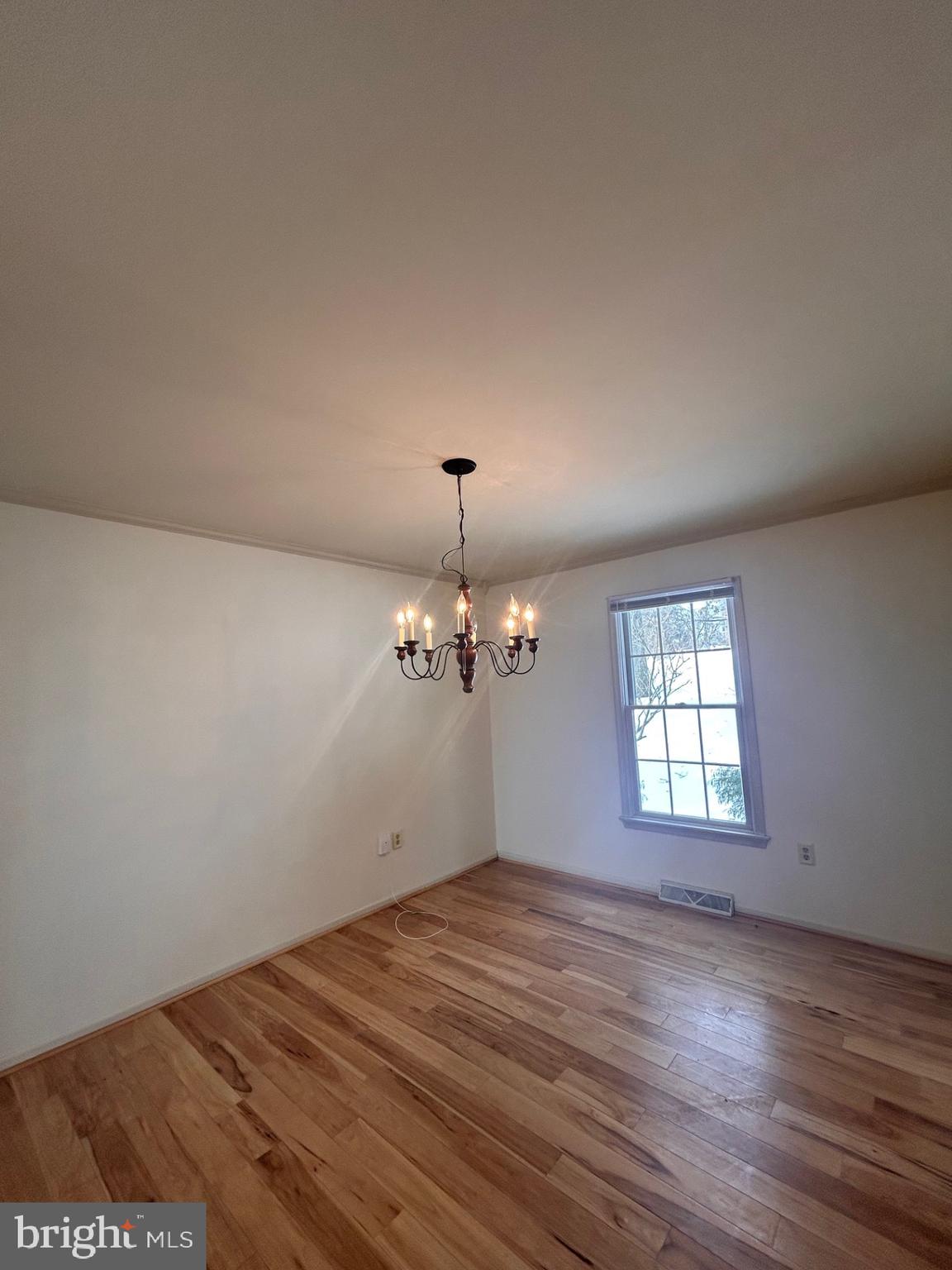 1110 Gora Road South York, PA 17404 - Photo 4 of 15 an empty room with wooden floor and windows