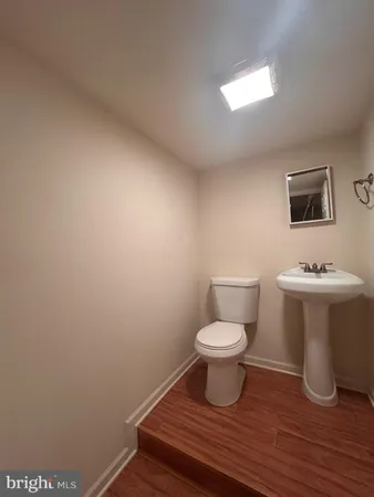 a bathroom with a toilet and a sink