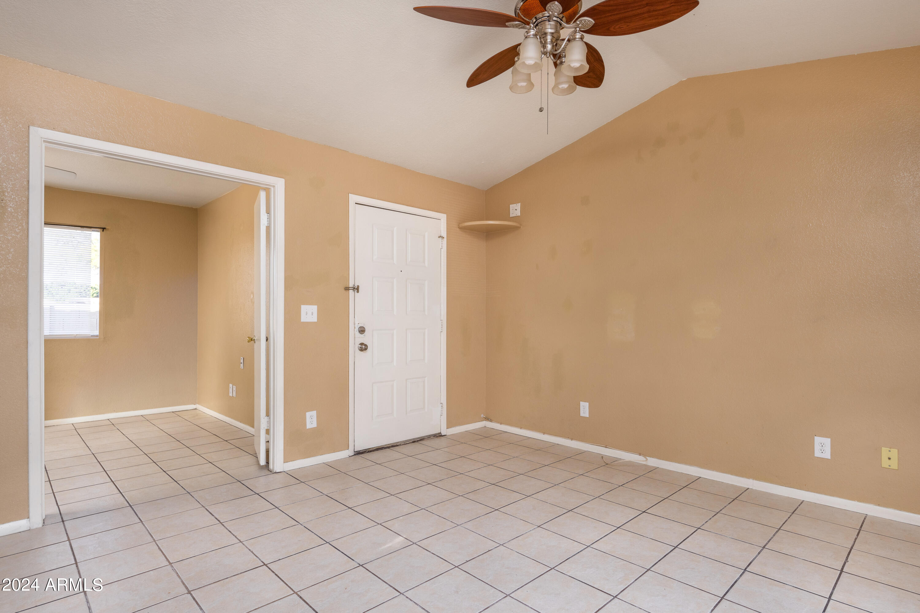 653 West Guadalupe Road, Unit 1121 Mesa, AZ 85210 - Photo 11 of 27 a view of a livingroom with a ceiling fan and window