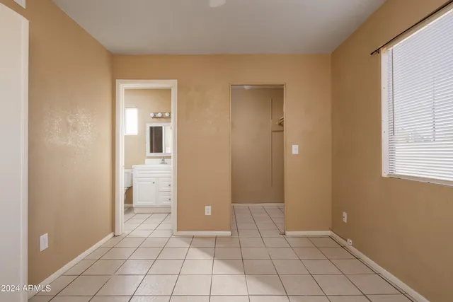 a view of an empty room and fire place