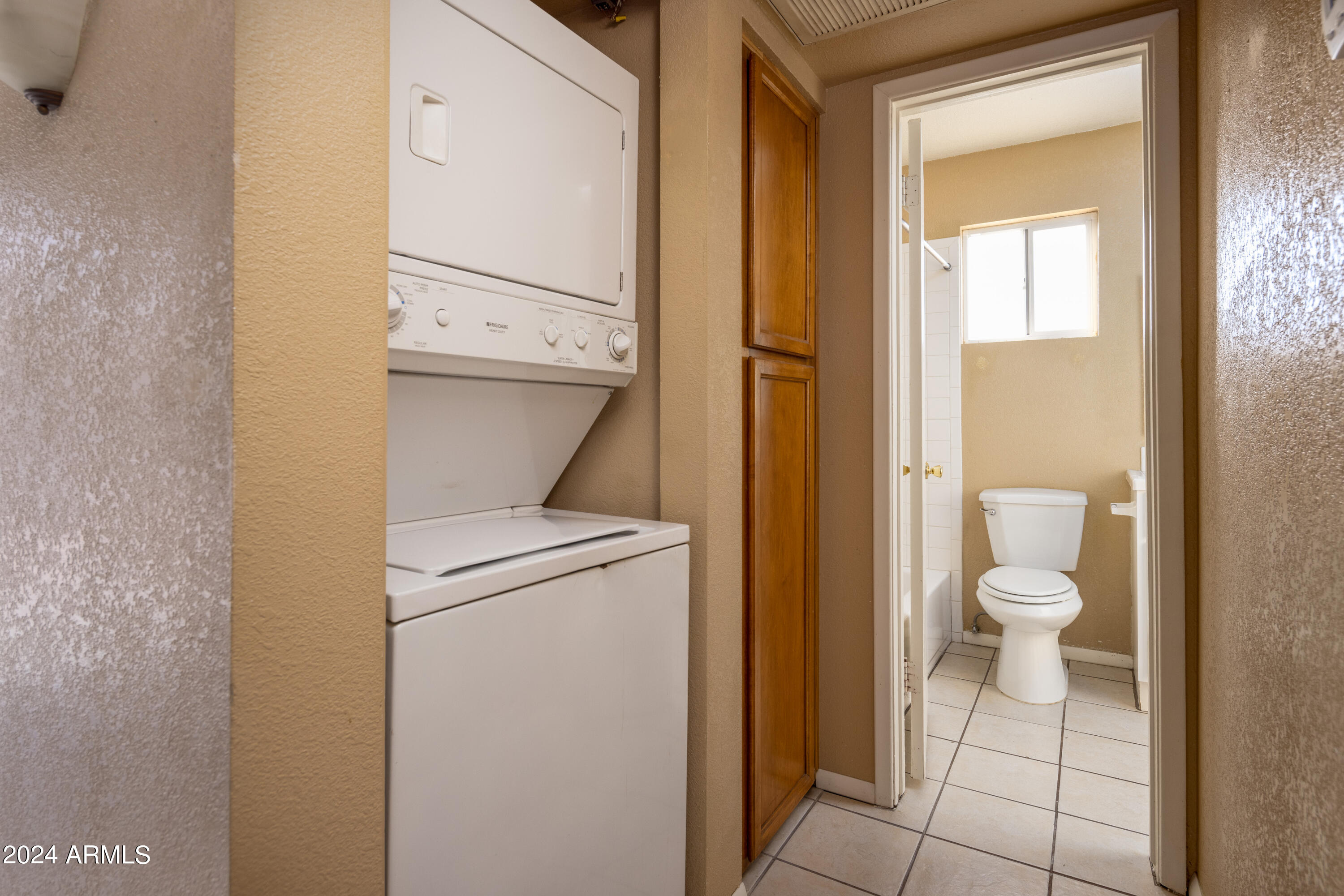 653 West Guadalupe Road, Unit 1121 Mesa, AZ 85210 - Photo 15 of 27 a view of a hallway with toilet and a bathroom