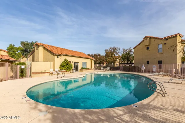 a view of a swimming pool with a patio