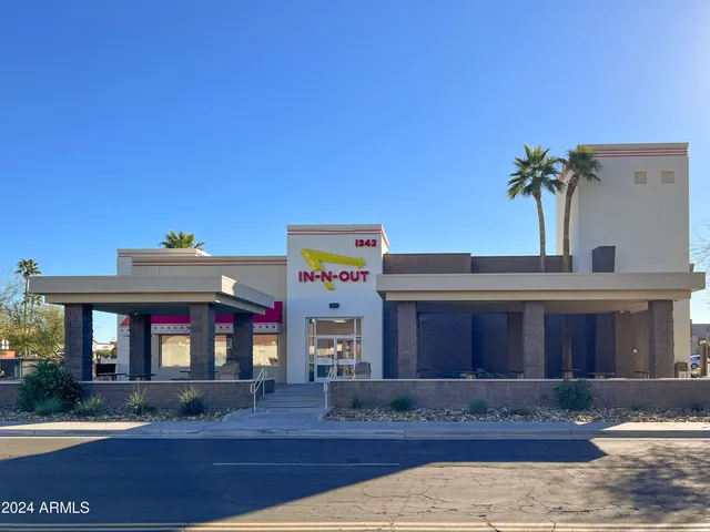 a front view of building with a yard