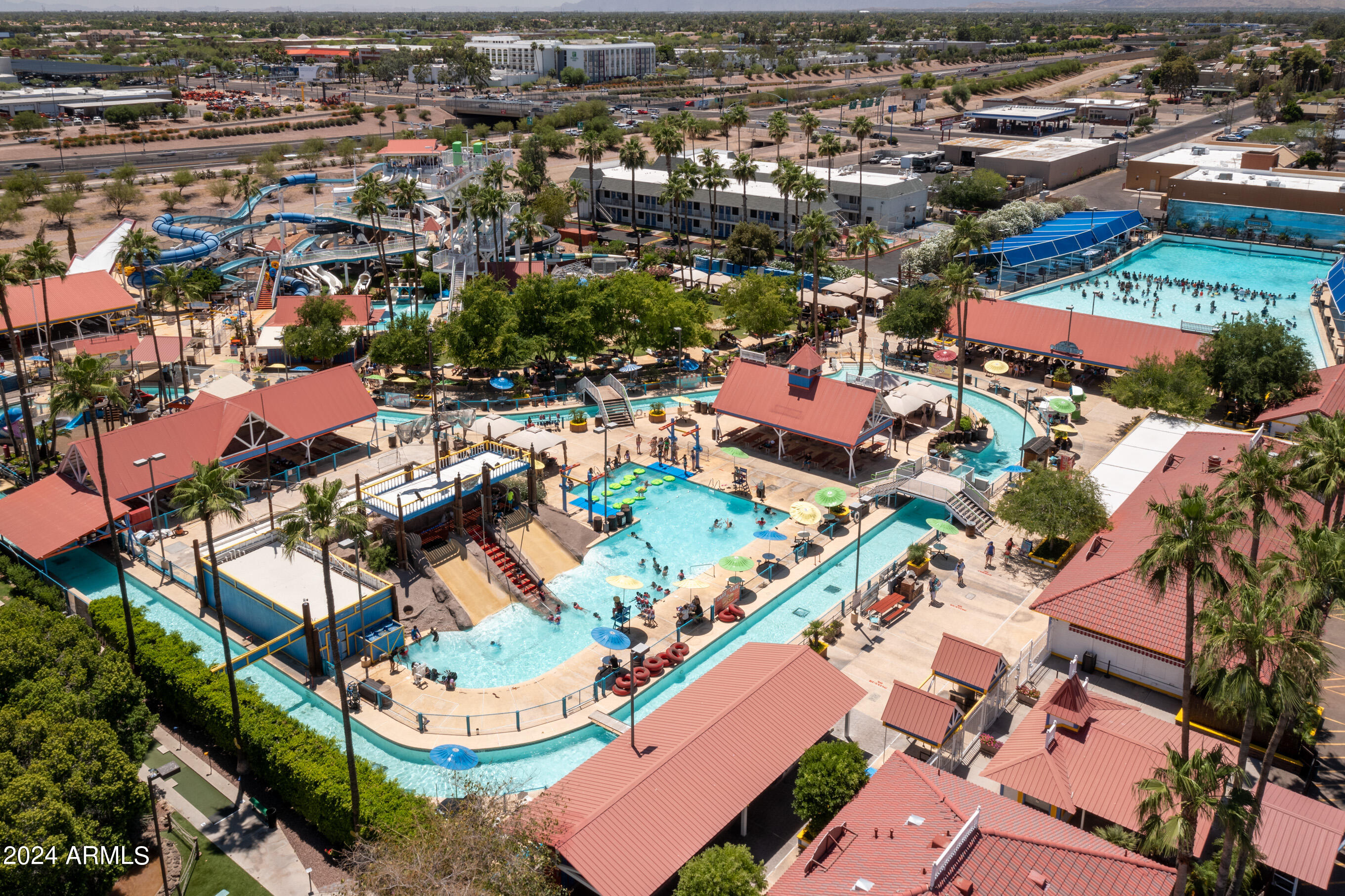 653 West Guadalupe Road, Unit 1121 Mesa, AZ 85210 - Photo 23 of 27 an aerial view of residential houses with outdoor space