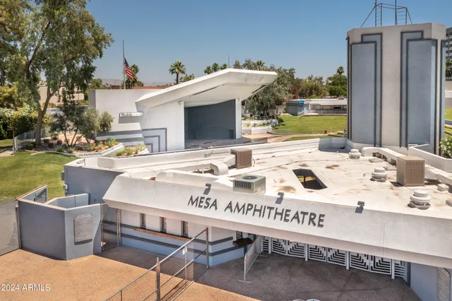 a view of a patio with table and chairs