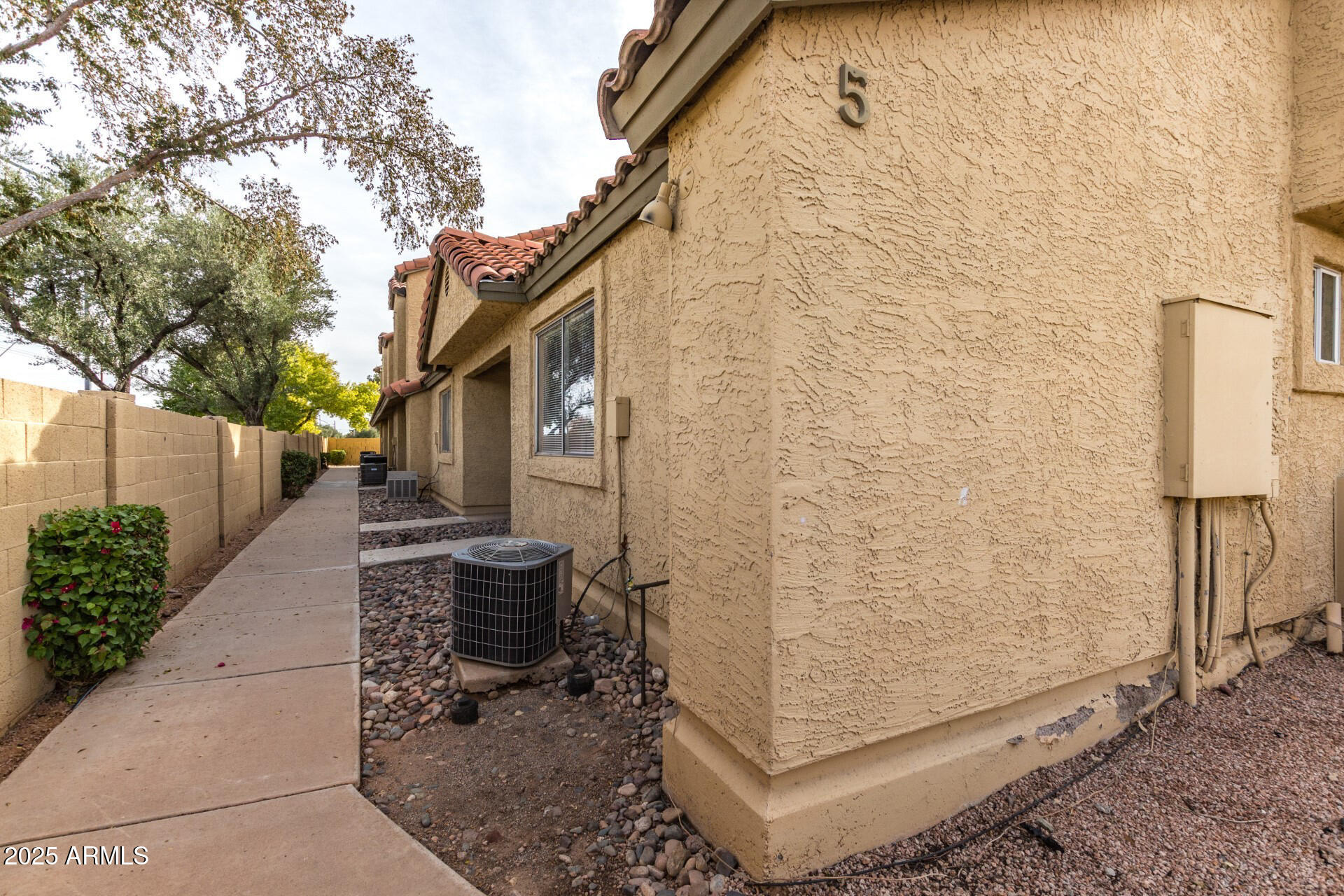 653 West Guadalupe Road, Unit 1121 Mesa, AZ 85210 - Photo 2 of 27 a view of a porch with potted plants